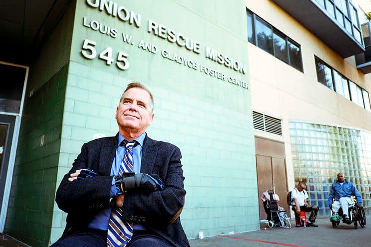 Andy Bales seated in front of Union Rescue Mission on Skid Row